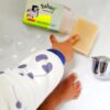 toddler hand and feet close up while reaching for organic soap from bahari coconut east africa kenya manufacturer health and cooking products
