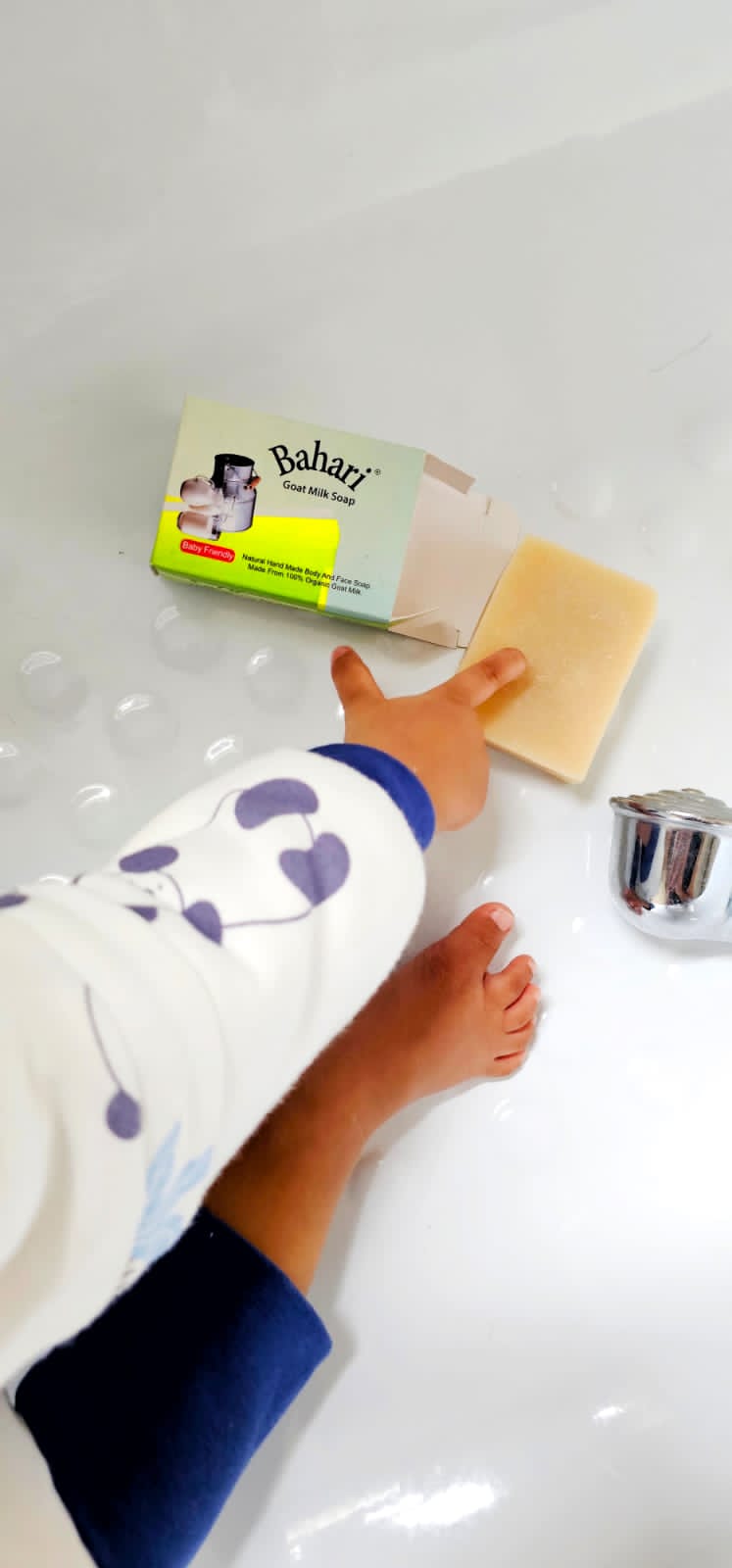 toddler hand and feet close up while reaching for organic soap from bahari coconut east africa kenya manufacturer health and cooking products